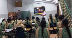 Students having an AI workshop in the library